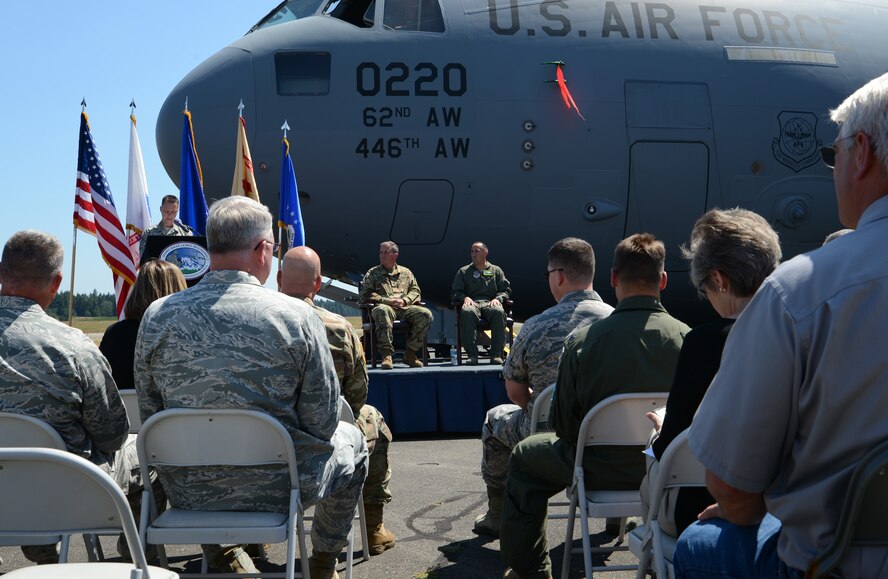 Master Sgt. Michael Bianco, 62nd Aircraft Maintenance Squadron production superintendent, welcomes guests to a C-17 Globemaster III naming ceremony July 5, 2017, at Joint Base Lewis-McChord, Wash. The C-17, tail number 10-0220, was named the Spirit of Joint Base Lewis-McChord in honor of all service members who have served at the joint base. (U.S. Air Force photo/Senior Airman Jacob Jimenez) 