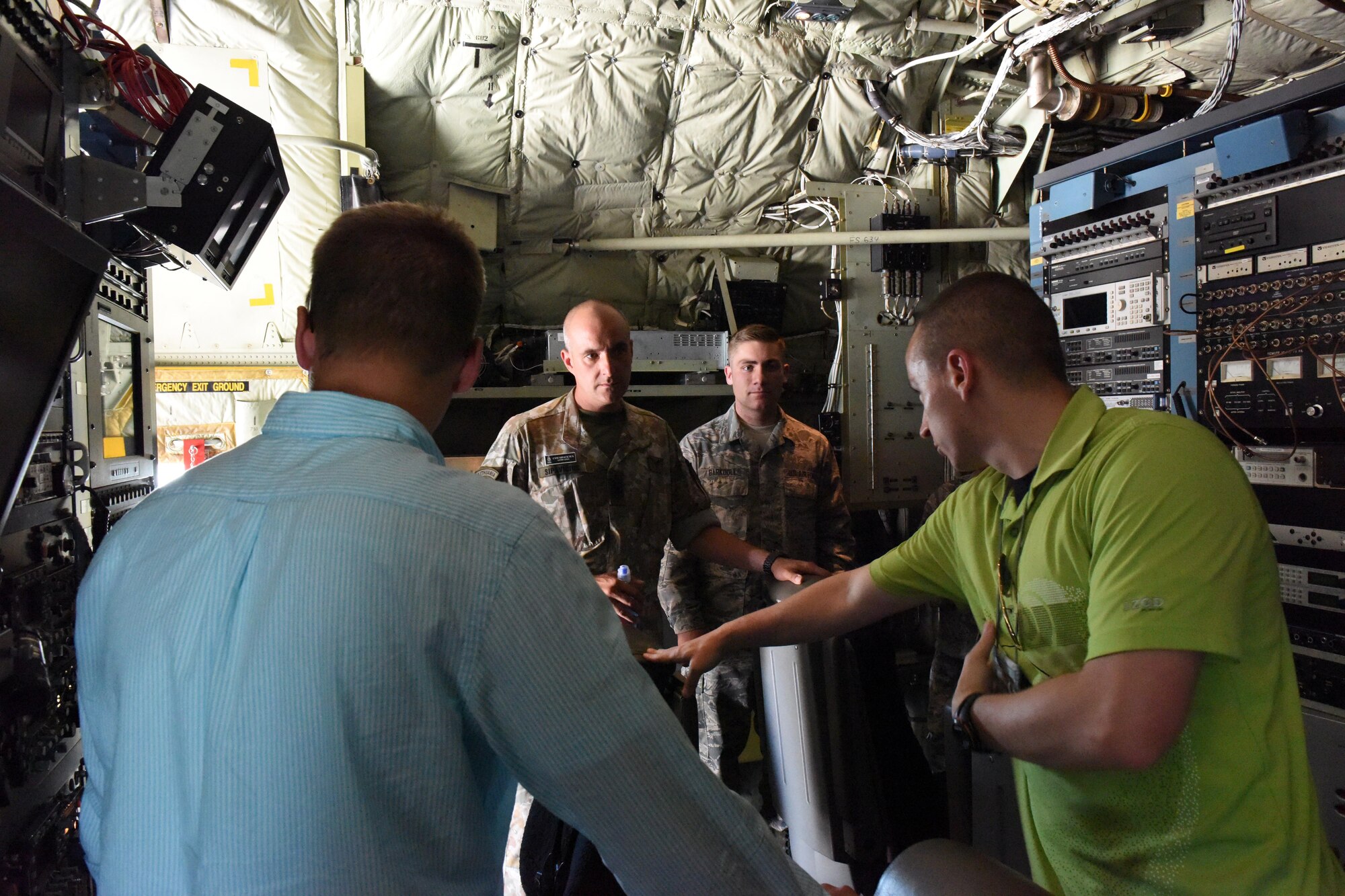 Tech. Sgt. Joseph Sherbaum, 193rd Special Operations Wing airborne mission system specialist, right, explains the electronic systems in the backend of an EC-130J Commando Solo aircraft to Lithuanian Army Command Sgt. Maj. Jonas Sipavicius during a tour of the wing, Middletown, Pennsylvania, June 30, 2017. After completing the United States Army Sergeants Major Academy at Fort Bliss, Texas, Sipavicius made a trip to Pennsylvania before heading home. Pennsylvania has had a state-country partnership program with Lithuania since 1993. (U.S. Air National Guard photo by Master Sgt. Culeen Shaffer/Released)