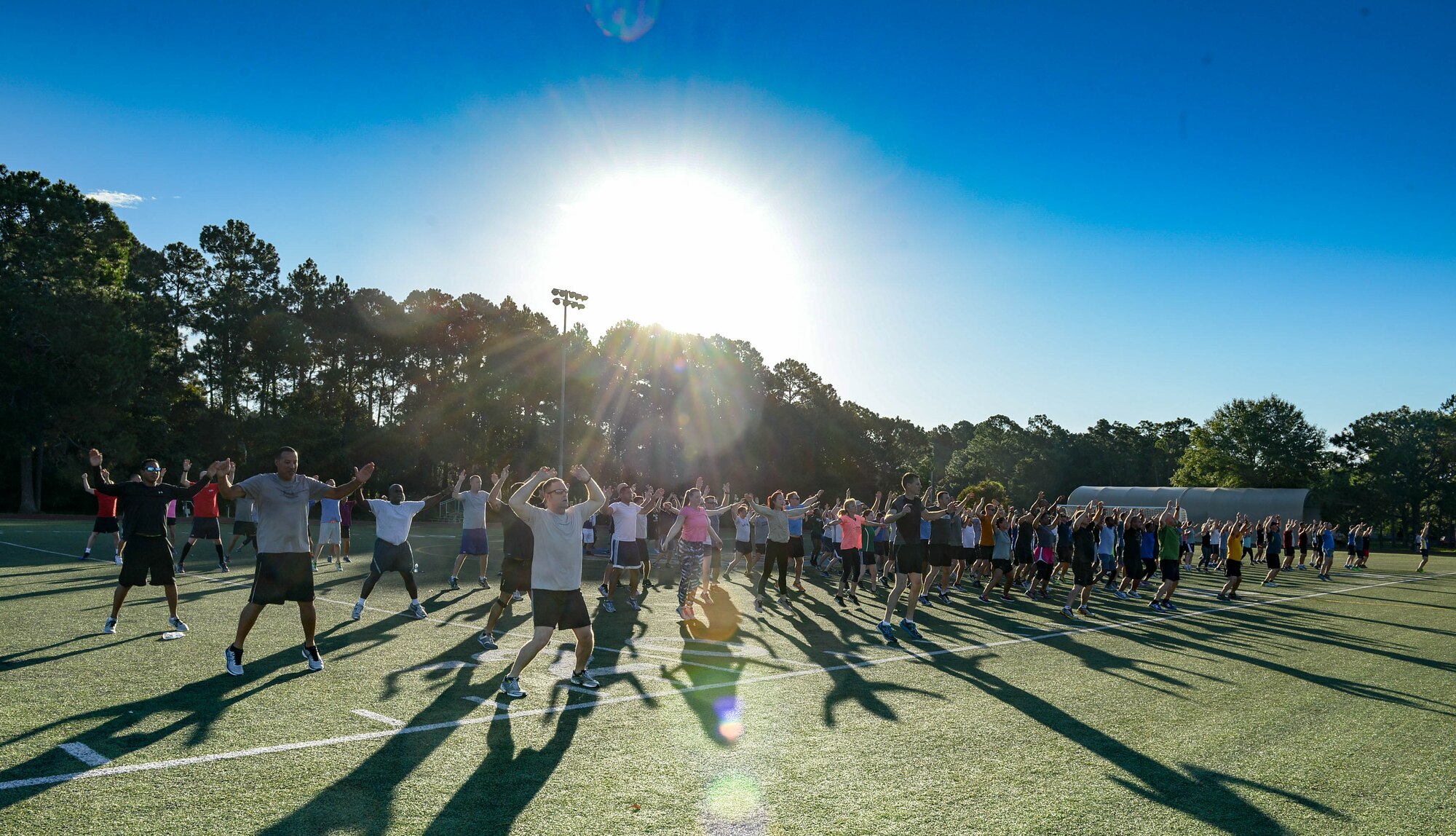 The Headquarters Air Force Special Operations Command staff warms up at Hurlburt Field, Fla., May 5, 2017. These Air Commandos meet the first Friday of every month to run a 5K. (U.S. Air Force photo/Staff Sgt. Melanie Holochwost)