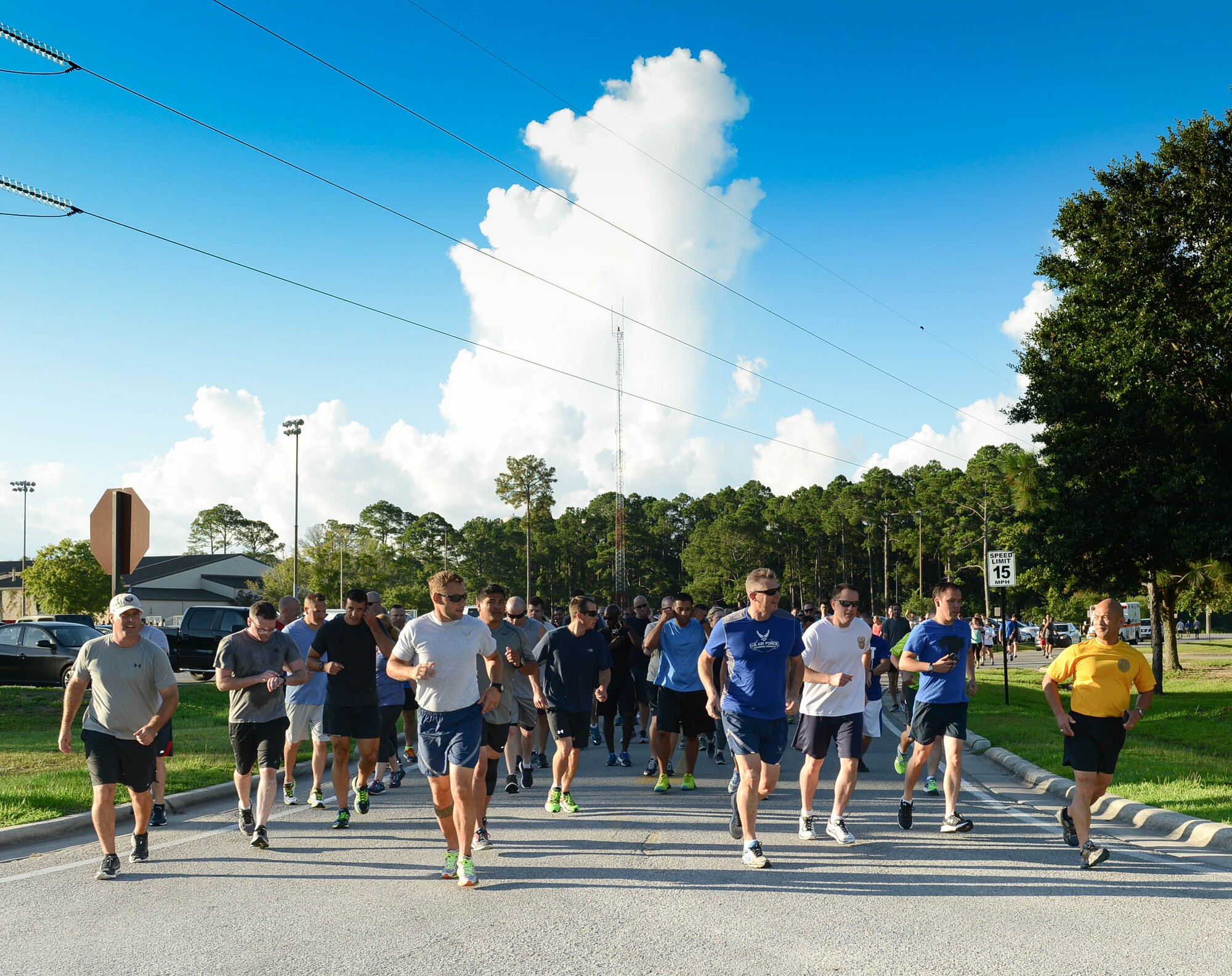 Air Commandos begin the Command Run at Hurlburt Field, Fla., July 7, 2017. Both Airmen and civilians at Headquarters Air Force Special Operations Command ran a 5K together during a physical training session. (U.S. Air Force photo/Staff Sgt. Melanie Holochwost)
