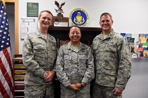 Chaplain (Capt.) Portmann Werner, 50th Space Wing chaplain, Staff Sgt. Marcela Parker, NCO in charge of chapel administration and Chaplain (Maj.) David Hager, Individual Mobilization Augmentee to the Wing Chaplain, gather for a photo at Schriever Air Force Base, Colorado, Wednesday, July 5, 2017. Regardless of one’s religious background and beliefs, the Chaplain’s Office is here provide a number of services to keep Airmen spiritually resilient and fit to fight. (U.S. Air Force photo/Senior Airman Arielle Vasquez)