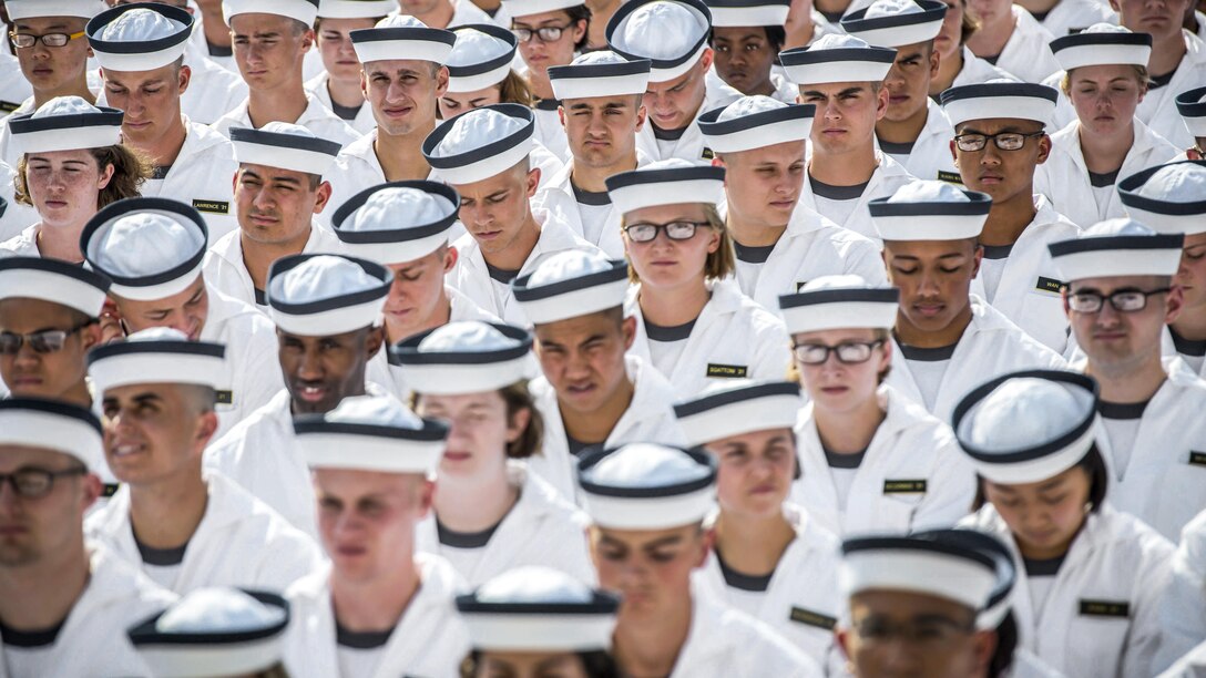Incoming plebes participate in an oath of office ceremony during Induction Day 2017 at the U.S. Naval Academy in Annapolis, Md., June 29, 2017. Induction Day kicks off Plebe Summer, a six-week training period designed to facilitate students’ transition from civilian to military life. Navy photo by Petty Officer 1st Class Patrick Enright