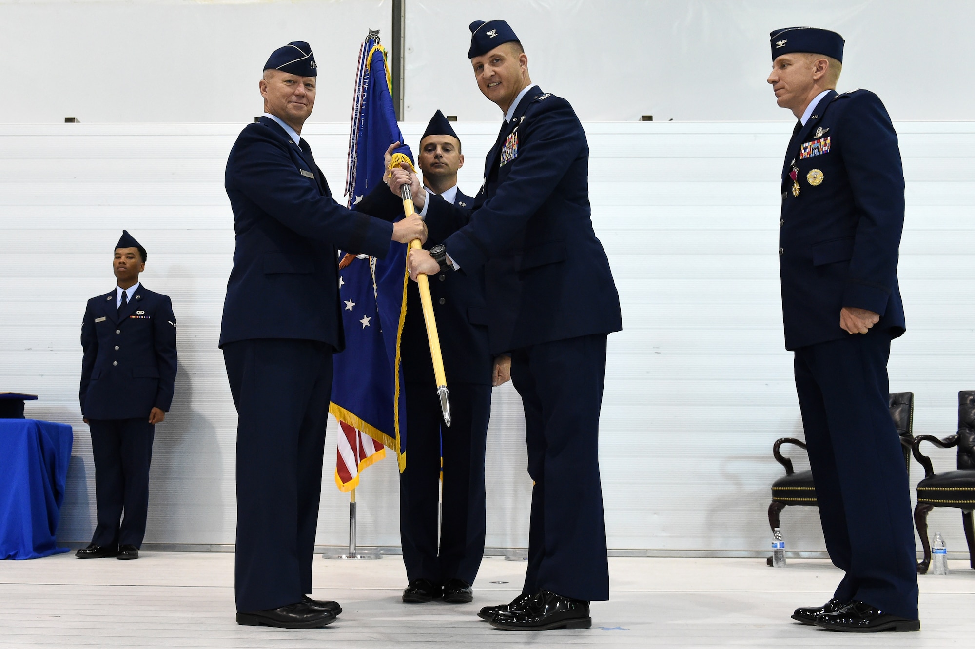 Col. Julian Cheater assumes command of the 432nd Wing from Lt. Gen. Mark Kelly, 12 Air Force commander July 6, 2017, at Creech Air Force Base, Nev. Going forward, Col. Cheater’s priorities are: winning today’s war while preparing for contested environment, developing our Airmen, strengthening our extended Hunter family and empowering our people as they innovate the remotely piloted aircraft community. (U.S. Air Force photo/Airman 1st Class James Thompson)