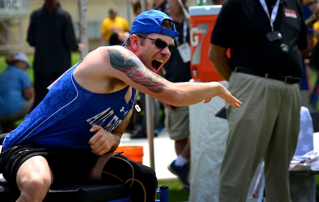 Staff Sgt. David Olson, an explosive ordnance disposal troop from Abilene, Texas, competes in the seated shot put at the 2017 Department of Defense Warrior Games July 5, 2017, at Soldier Field, Chicago, Ill. A brush with suicide occurred near the beginning of 2017, and Olson recounted his personal struggle with suicidal ideations along with the toll his physical and invisible wounds have taken not just on his life, but on those of his loved ones. (U.S. Air Force photo/Staff Sgt. Alexx Pons)
