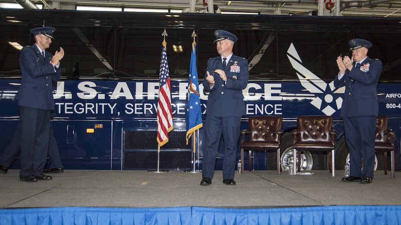 Col. E. John Teichert, left, 11th Wing and Joint Base Andrews commander, and Col. William H. Kale III, right, former 11th Mission Support Group commander, applaud for Col. Bradley L. Johnson, 11th MSG commander, during a change of command ceremony at Joint Base Andrews, Md., July 6, 2017. Johnson will preside over 1,500 personnel providing civil engineer, contracting, force support and logistics capabilities to 16,000 personnel throughout the National Capital Region. (U.S. Air Force photo by Senior Airman Jordyn Fetter)