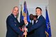 U.S. Air Force Maj. Darryl Hebert, 20th Force Support Squadron (FSS) commander, recieves the 20th FSS guidon from Col. David Vaclavik, 20th Mission Support Group commander, during a change of command ceremony at Shaw Air Force Base, S.C., July 7, 2017. The 20th FSS provides administrative support and services such as lodging, child care and education services, to the base community. (U.S. Air Force photo by Airman 1st Class Kathryn R.C. Reaves)