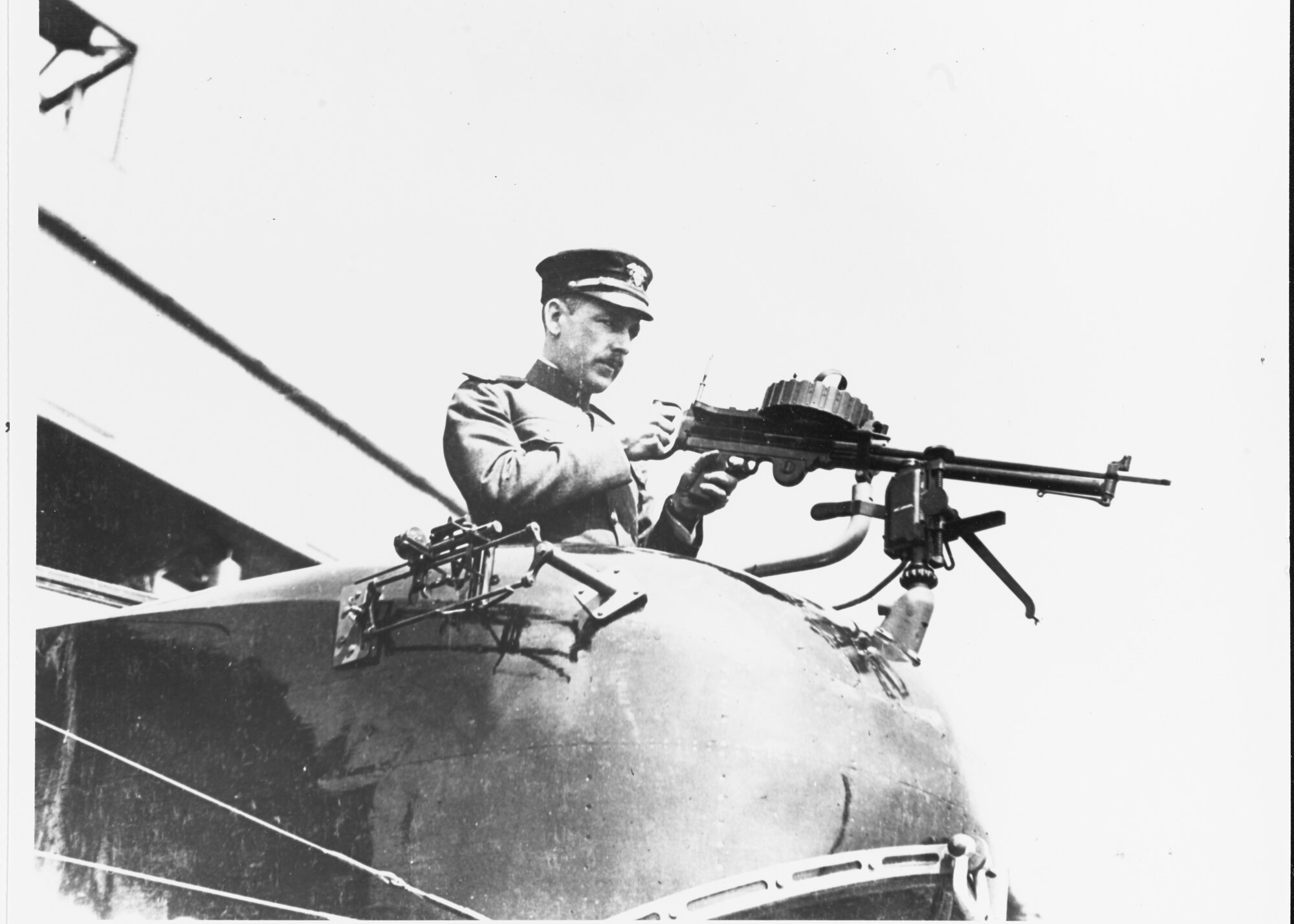 Navy Lt. Arthur E.J. Male, USNRF, in gunner's bow position, with a Lewis aircraft machine gun, at the Naval Aircraft Factory, Philadelphia, Pennsylvania, 25 March 1918. Note bomb sight on the plane's side, beside the gunner. (Photo courtesy Naval History and Heritage Command)