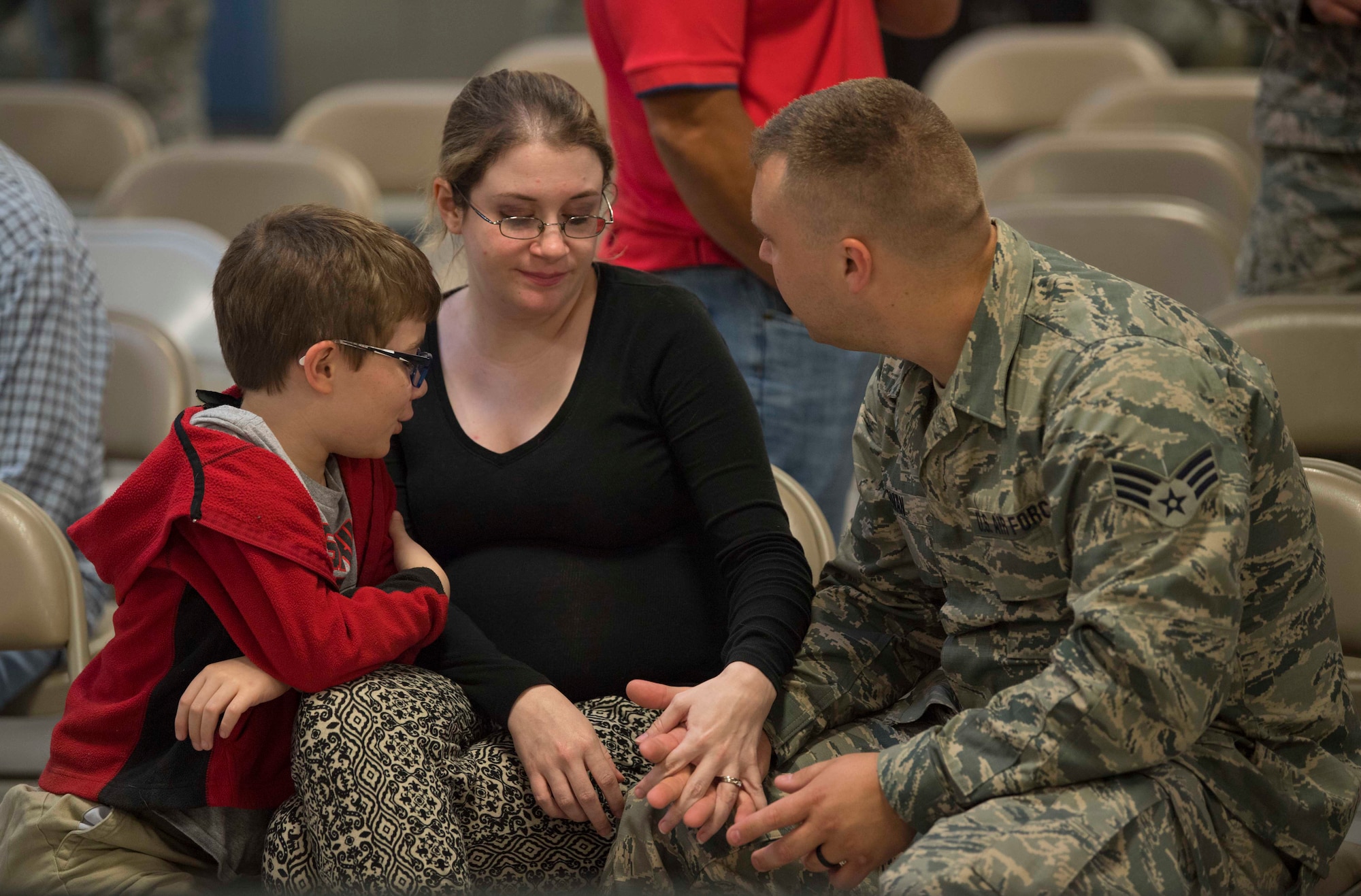 Senior Airman Gary Norman, consoles his wife, Emily, and son Shay prior to deploying in support of Operation Freedom’s Sentinel on June 25, 2017, at McLaughlin Air National Guard Base, Charleston, W.Va. Norman is an electrical environmental maintainer with the 130th Airlift Wing. (U.S. Air National Guard photo by Tech. Sgt. De-Juan Haley)