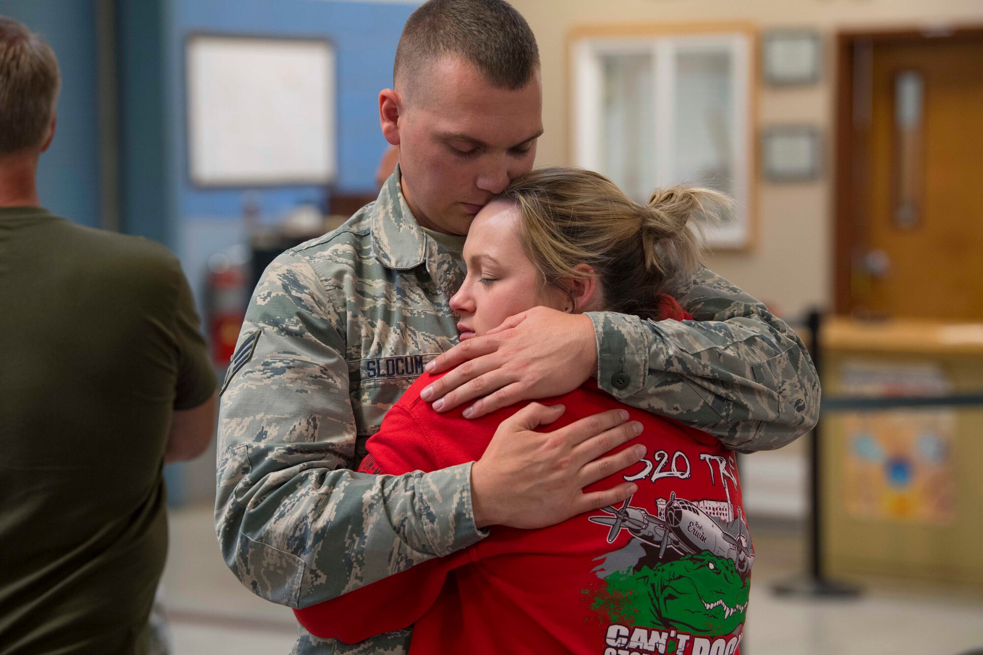 Senior Airman Nathan Slocum says his final goodbyes to a family member before deploying in support of Operation Freedom’s Sentinel June 27, 2017. Slocum is a crew chief with the 130th Aircraft Maintenance Squadron, McLaughlin Air National Guard Base, Charleston, W.Va. (U.S. Air National Guard photo by Staff Sgt. Adam Juchniewicz)