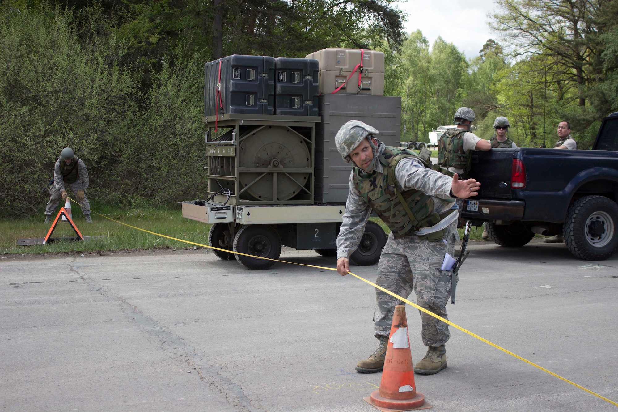 A Silver Flag instructor trains Airmen on the proper measurements during airfield damage repair at Ramstein Air Base, Germany, recently. The training was validated by the force development division of the Air Force Civil Engineer Center. (U.S. Air Force Photo/Susan H. Lawson)