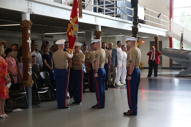 The outgoing commanding officer, Col. Jason Morris, and the incoming commanding officer, Col. David Fallon, exchange the passing of the colors during the 9MCD Change of Command ceremony aboard Naval Station Great Lakes, Ill., on July 7, 2017. (U.S. Marine Corps photo by Sgt. Jennifer Webster/Released)