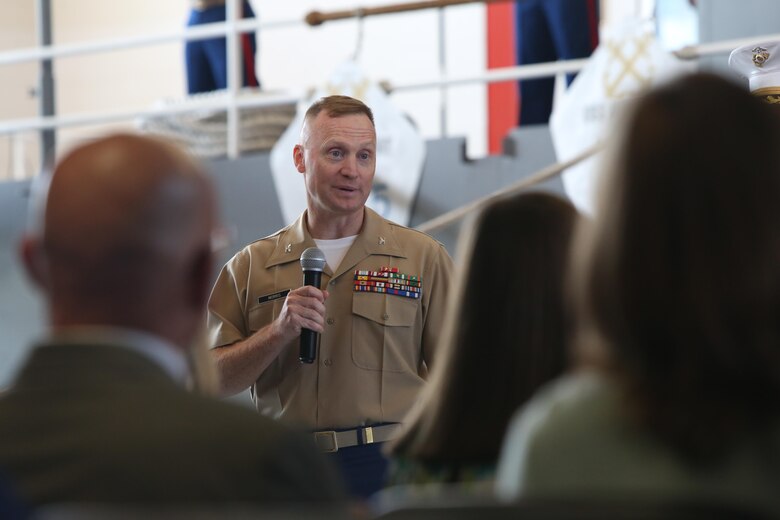 The outgoing commanding officer addresses service member, families and friends during the 9MCD Change of Command ceremony aboard Naval Station Great Lakes, Ill., on July 7, 2017. (U.S. Marine Corps photo by Sgt. Jennifer Webster/Released)
