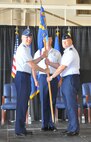 Major Gen. Scott Vander Hamm, assistant deputy chief of staff, operations, Air Force Headquarters, left, hands the guidon to Col. Michael J. Price during a change of command ceremony June 22 at the Will Rogers Air National Guard Base. The colonel took the reins of the approximately 200-member Air Force Flight Standards Agency. Master Sgt. Jeremy Sykora was the guidon bearer. (Air Force photo by John Parker)
