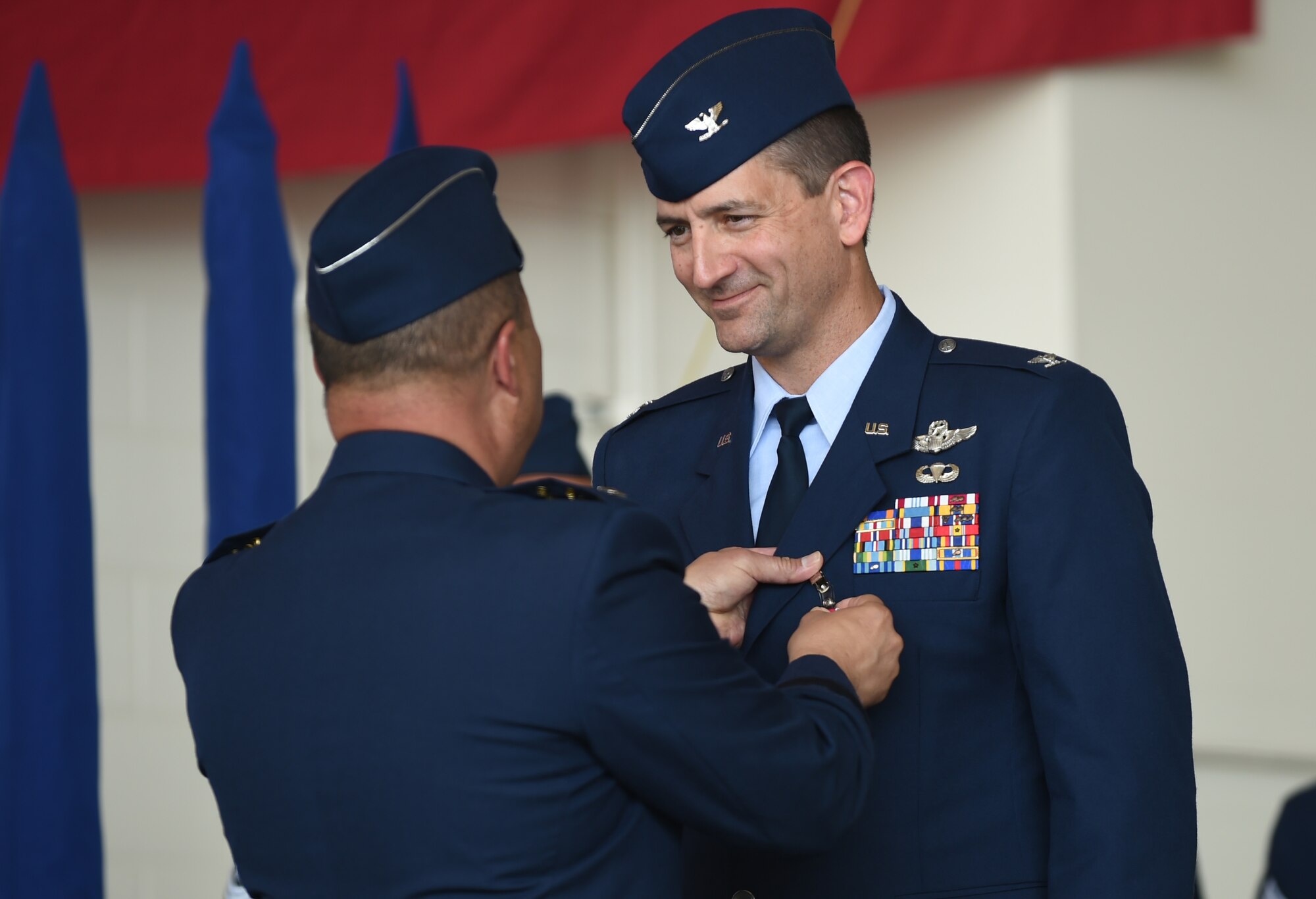 U.S. Air Force Col. Stephen Hodge, right, 317th Airlift Group commander, is awarded the Legion of Merit by Lt. Gen. Giovanni Tuck, 18th Air Force commander, at Dyess Air Force Base, Texas, July 6, 2017. The Legion of Merit is awarded for exceptionally meritorious conduct in performance of outstanding services. The performance recognizes key individuals for service rendered in a clearly exceptional manner. (U.S. Air Force photo by Airman 1st Class Emily Copeland)