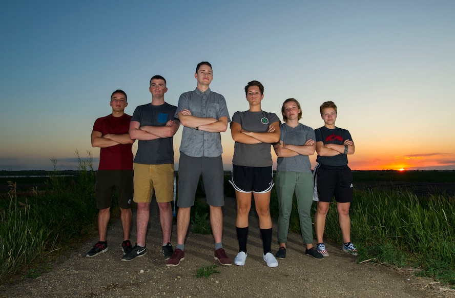 From Left:  Senior Airmen Christopher Velazquez, Justin Valentine, Jake Nixon, Airmen 1st Class Kayla Loftis,  Hannah and Allie Staffen helped rescue a man from a bison attack during a camping trip in Theodore Roosevelt National Park’s North Unit, N.D. on July 1, 2017. The group assessed the man’s injuries and called for help, all while the bison loomed in the area. (Not pictured: Airman 1st Class Logan Oldenburg)  (U.S. Air Force photo/Senior Airman Apryl Hall)