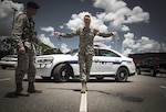 Airman 1st Class Erick Requadt, 23d Wing photojournalist, simulates a field sobriety test, July 7, 2017, at Moody Air Force Base, Ga. When an Airman receives a driving under the influence charge, they are eligible to receive both a civilian conviction if caught off base, as well as a punishment given at their commander’s discretion. The final sentence could cost thousands of dollars in fines, suspension of their license, negative paperwork, administrative demotion, and possible loss of career or reclassification. (U.S. Air Force photo illustration by Airman 1st Class Lauren M. Sprunk)