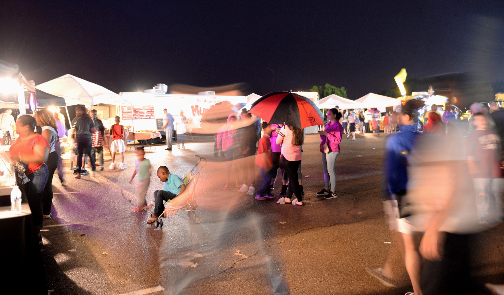 People purchase food from various vendors during Fireworks on the Water July 1, 2017, at the Stennis Lock and Dam in Columbus, Mississippi. Many vendors sold food to volunteers and families on location throughout the whole event. (U.S. Air Force photos by Airman 1st Class Keith Holcomb)