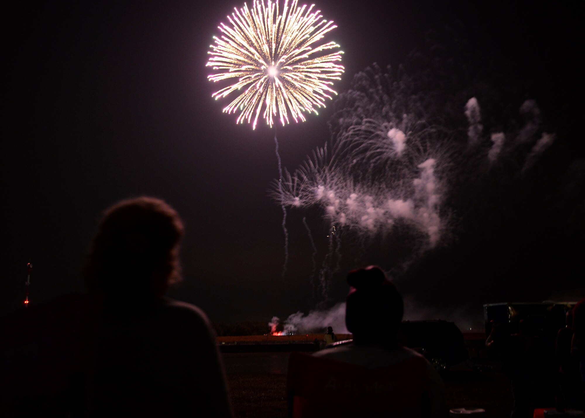 Families watch the fireworks display during Fireworks on the Water July 1, 2017, at the Stennis Lock and Dam in Columbus, Mississippi. Even through weather complications the fireworks show was still able to be put on display. (U.S. Air Force photos by Airman 1st Class Keith Holcomb)