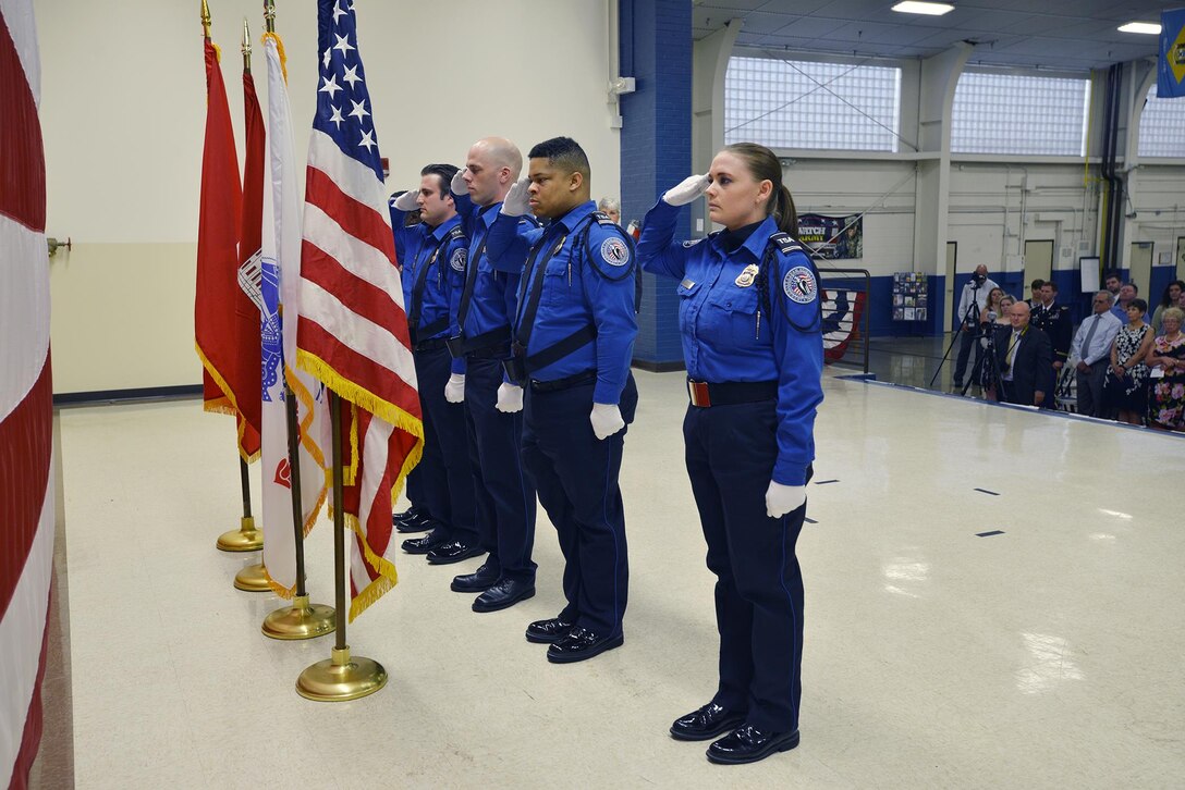 The Nashville Airport TSA Honor Guard salutes the colors during the change of command ceremony at the Tennessee National Guard Armory in Nashville, Tenn. July 7, 2017.  