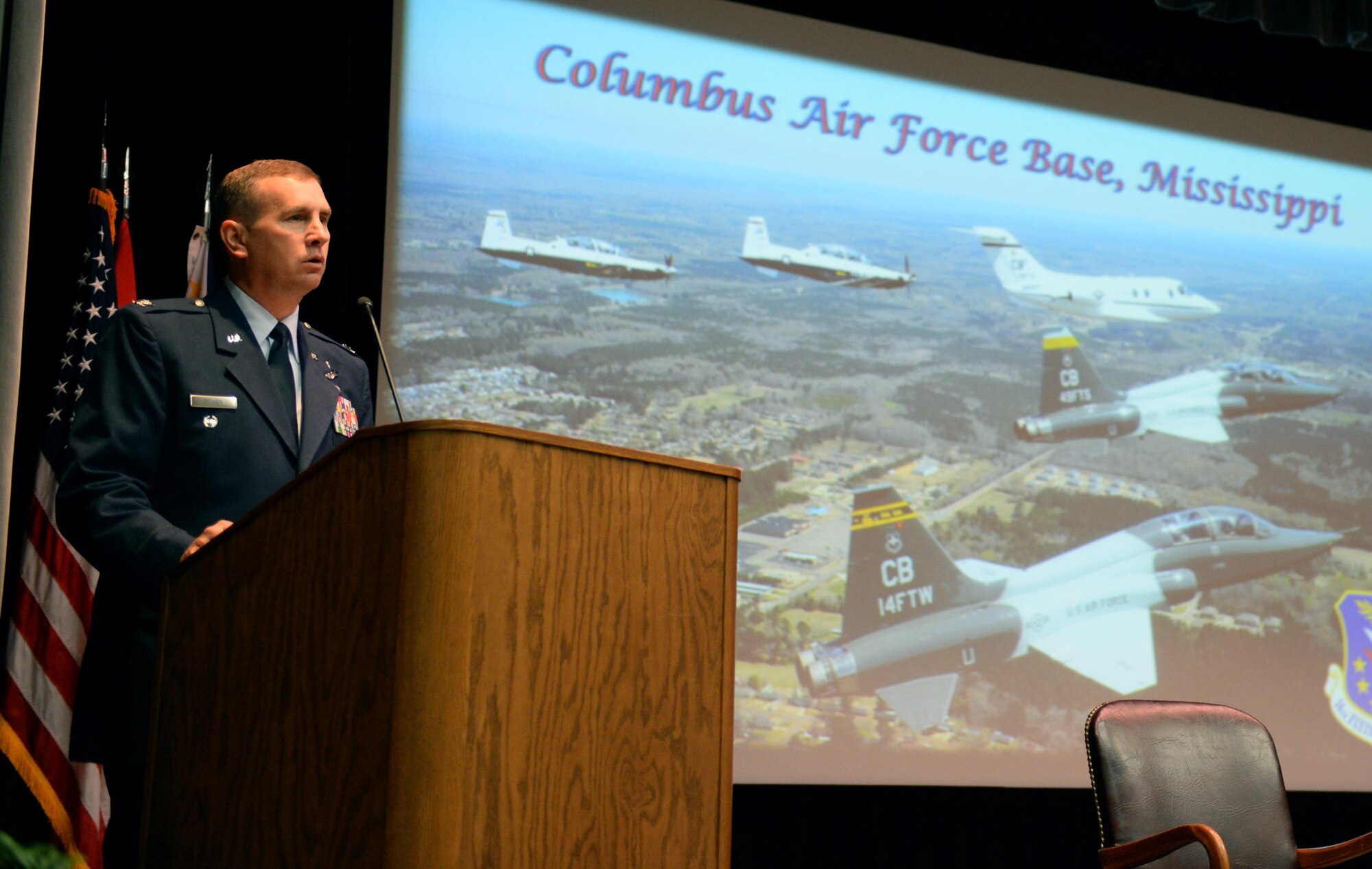 Col. James Fisher, 14th Flying Training Wing Vice Commander, speaks at the graduation of Specialized Undergraduate Pilot Training Class 17-11 June 30, 2017, at Columbus Air Force Base, Mississippi. Fisher himself graduated from the pilot training program at Columbus AFB in 1997 in SUPT Class 97-04. (U.S. Air Force photo by Airman 1st Class Keith Holcomb)