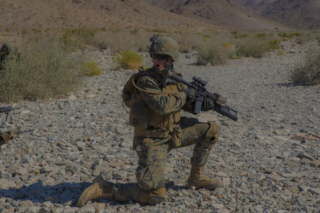 TWENTYNINE PALMS, Calif.- Cpl. John Johnson, a squad leader with Echo Company, 2nd Battalion, 24th Marine Regiment, 4th Marine Division, Marine Forces Reserve, calls out to his squad at range 410A at Marine Corps Air Ground Combat Center Twentynine Palms, California on June 26, 2017. The battalion conducted live-fire platoon attacks at the range during Integrated Training Exercise 4-17, which requires battalions and squadrons to integrate together as a cohesive team through shared planning, briefing, rehearsals, execution and debriefing.
