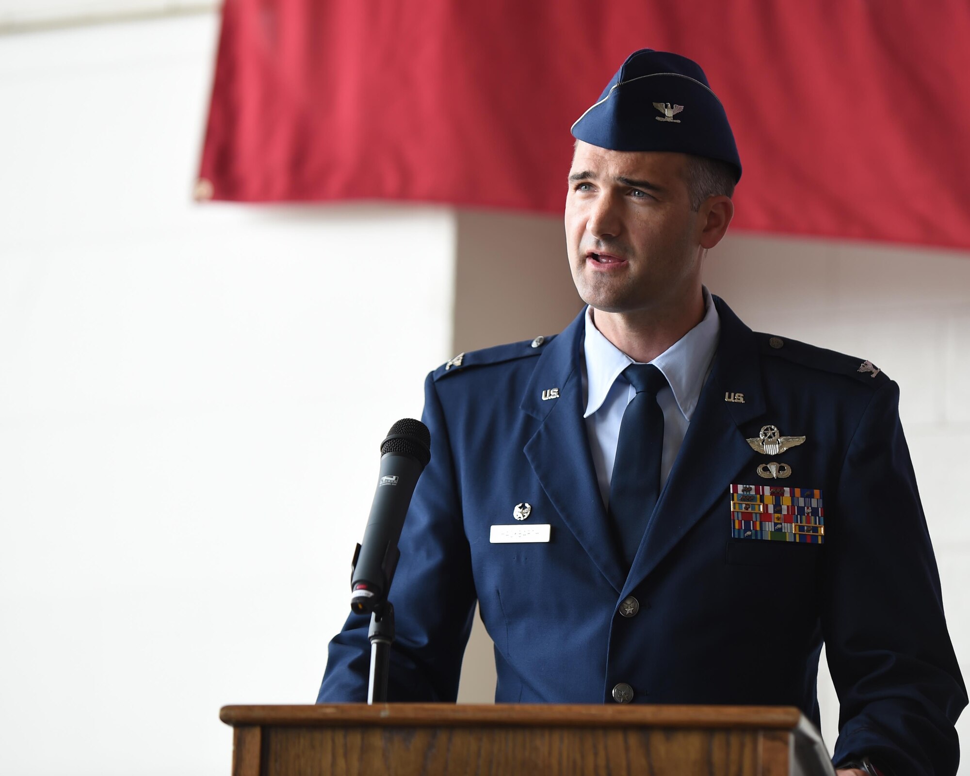 U.S. Air Force Col. James Hackbarth, 317th Operations Group commander, addresses his new unit, as well as the 317th Airlift Wing, at Dyess Air Force Base, Texas July, 6, 2017. The 317th OG was activated when the 317th Airlift Group was deactivated and activated as the 317th Airlift Wing. (U.S. Air Force photo by Senior Airman Alexander Guerrero)