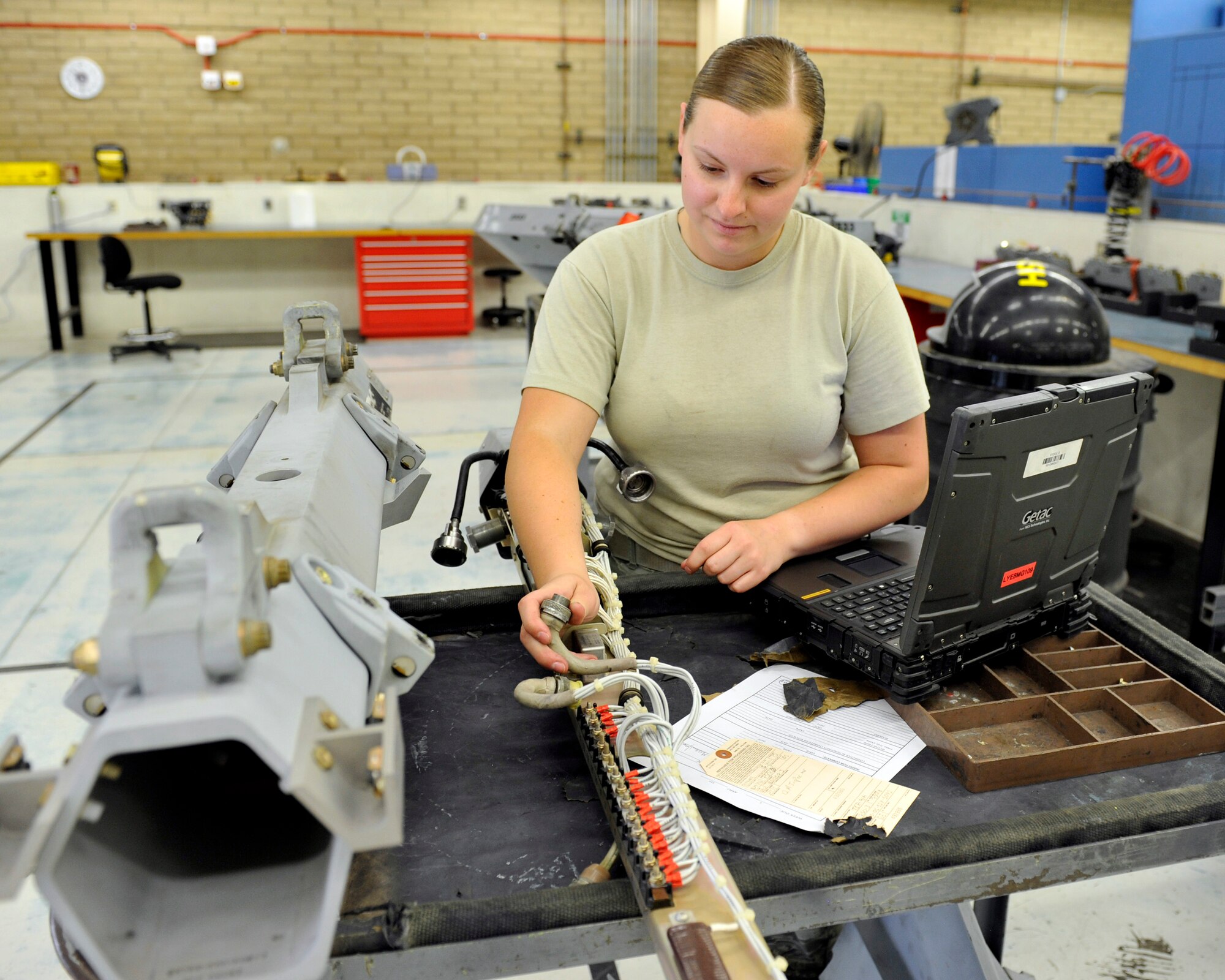 Senior Airman Crysta Bass, 56th Equipment Maintenance Squadron armament flight maintenance technician, performs a visual inspection of the electrical tray assembly on an Triple Ejector Bomb Rack Jun 28,2016 at Luke Air Force Base, Ariz. A Technical Order system is used to perform the correct tests.(U.S. Air Force photo by Airman 1st Class Pedro Mota)