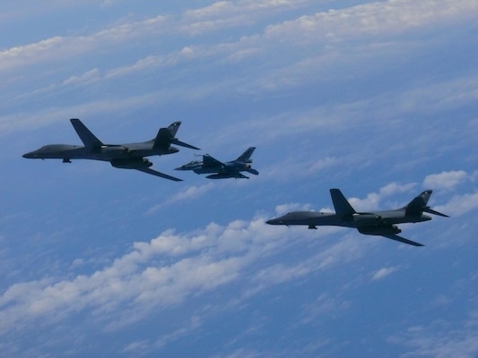 Two U.S. Air Force B-1B Lancers assigned to 9th Expeditionary Bomb Squadron, deployed from Dyess Air Force Base, Texas, fly with Koku Jieitai F-2 fighter jet over East China Sea, July 7, 2017
(Courtesy Japan Air Self-Defense Force)