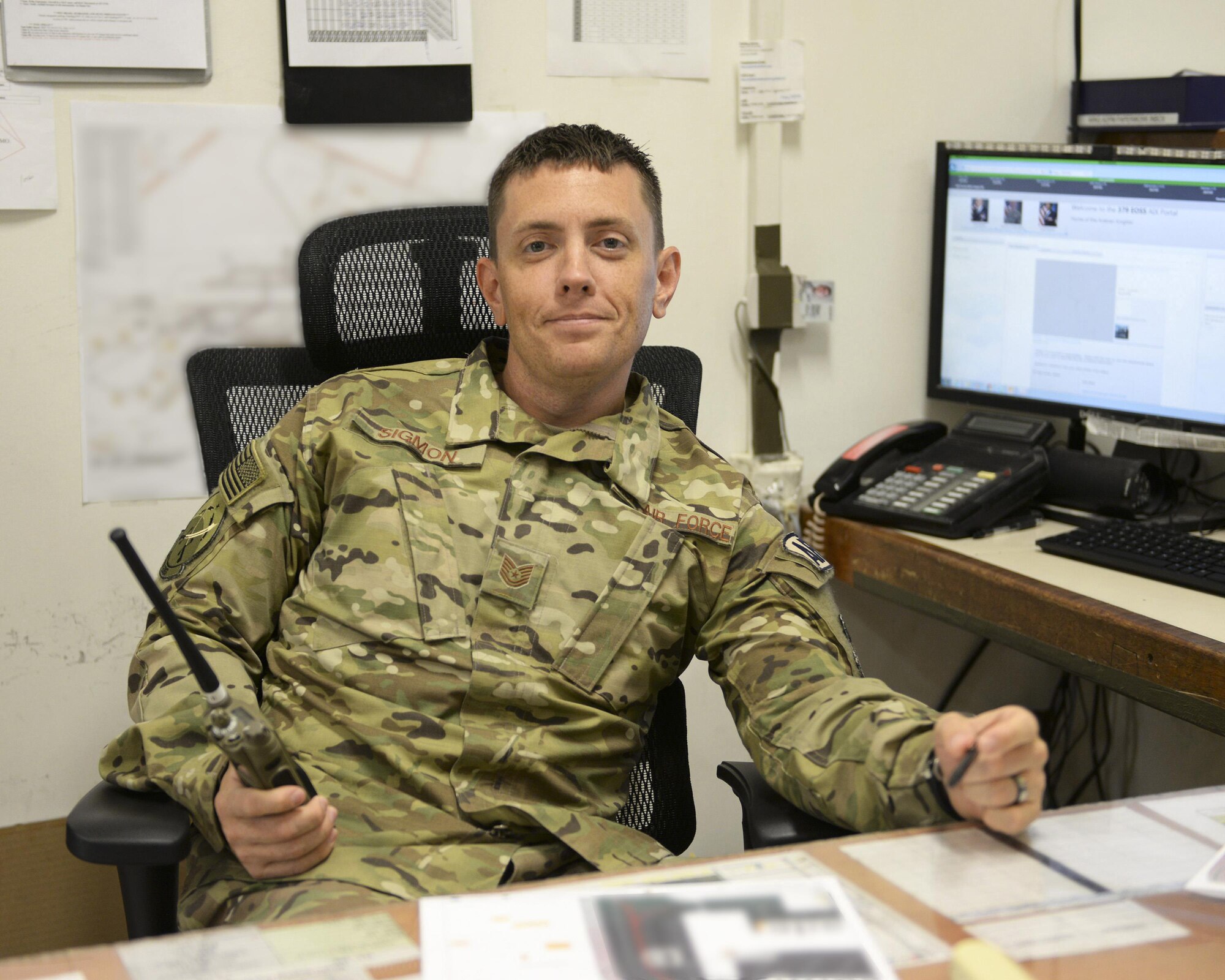 U.S. Air Force Tech. Sgt. Joseph Sigman, airfield manager assigned to the 379th Expeditionary Office of Strategic Services, oversees daily airfield management activities at Al Udeid, Air Force Base, Qatar, June 22, 2017. Airfield Management oversees more than 20 million square feet of airfield at Al Udeid in addition to overseeing the airfield driving program and filing all flight plans for flights arriving to and departing from the base. (U.S. Air National Guard photo by Tech. Sgt. Bradly A. Schneider/Released)