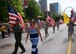 On July 1, 2017, the commander of the 932nd Airlift Wing's Operations Group, Col. Ray Smith, leads his volunteer wing members down the avenue as part of the community's outstanding Saint Louis VP parade, celebrating Independence Day.  The 932nd Airlift Wing is an Illinois wing flying the C-40 under 22nd Air Force and the Air Force Reserve Command.  (U.S. Air Force photo by Lt. Col. Stan Paregien)