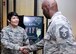 Chief Master Sgt. Imelda B. Johnson, 94th Airlift Wing command chief master sergeant, greets an Airman at the dining facility here, May 6, 2017. Chief Johnson is the newest command chief assigned to the 94th AW. (U.S. Air Force photo by Airman 1st Class Justin Clayvon)
