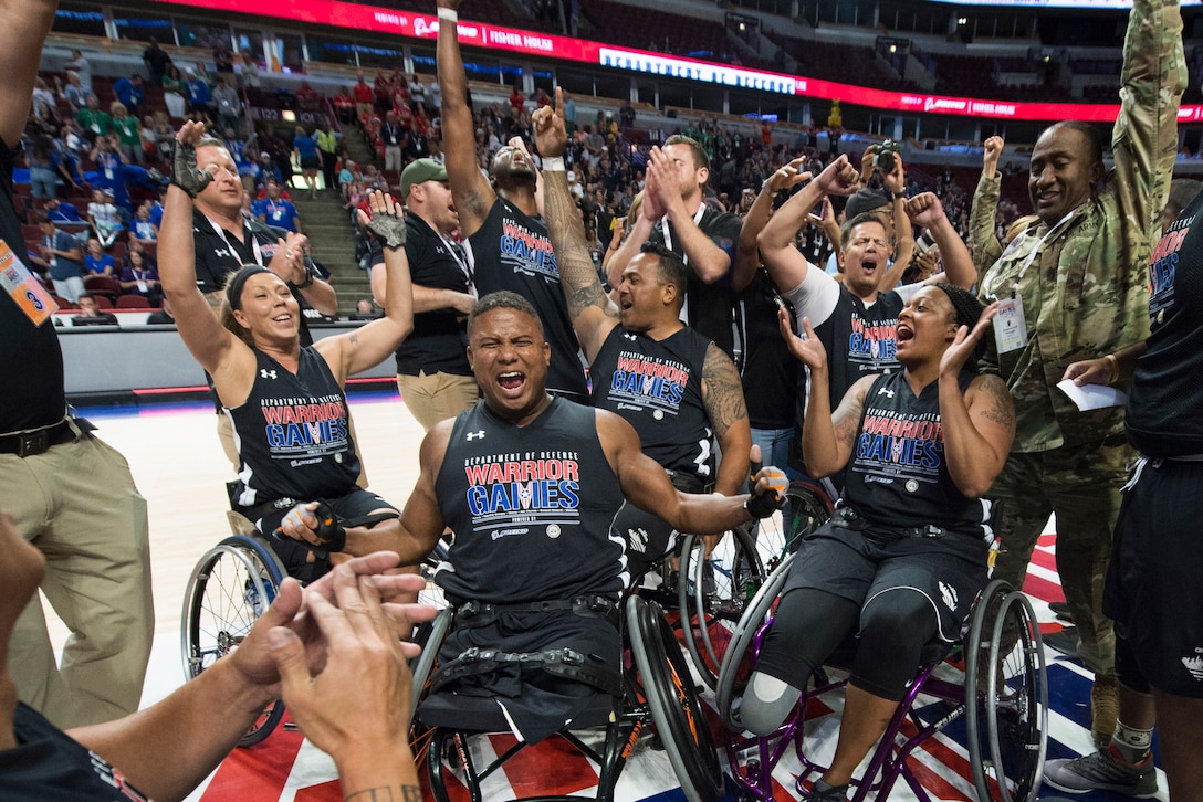 Team Army wheelchair basketball team celebrates a victory for gold during the 2017 Department of Defense Warrior Games at the United Center in Chicago, July 7, 2017. DoD photo by EJ Hersom