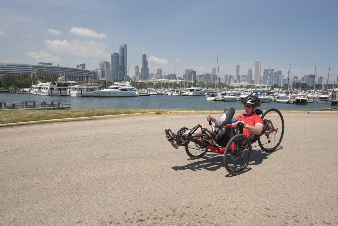 Marine SSgt. Danielle N. Pothoof competes in cycling during the 2017 Department of Defense (DoD) Warrior Games in Chicago, Ill., July 6, 2017. The DoD Warrior Games are an annual event allowing wounded, ill and injured service members and veterans to compete in Paralympic-style sports including archery, cycling, field, shooting, sitting volleyball, swimming, track and wheelchair basketball.    (DoD photo by Roger L. Wollenberg)