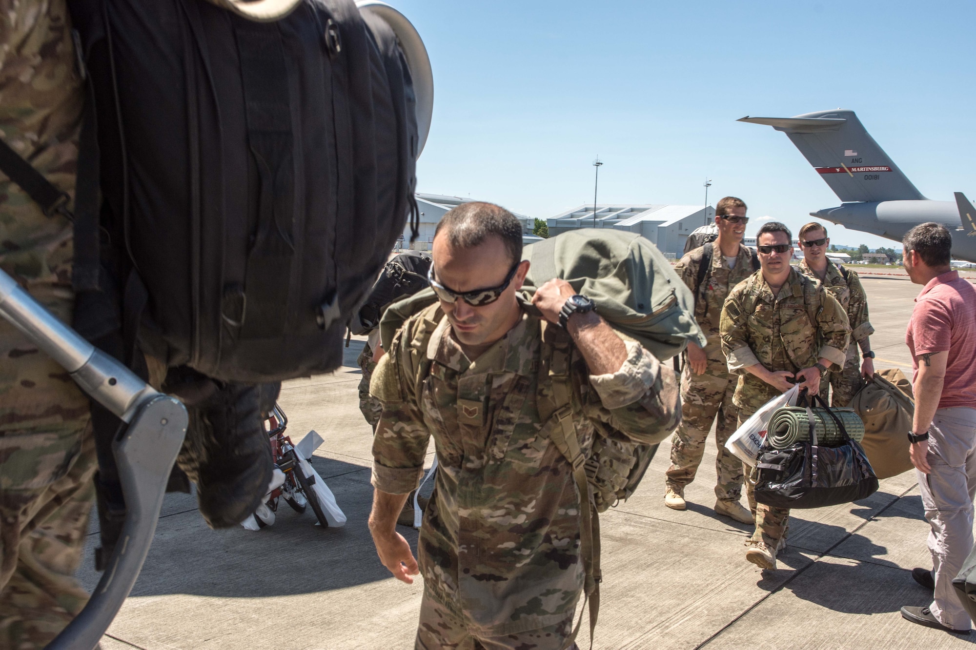 Members of the 304th Rescue Squadron board a C-17 Globemaster III in preparation for the unit’s largest deployment in its 60-year history, May 27, 2017, Portland, Oregon. (U.S. Air Force photo by Staff Sgt. Schaeffer Bonner)