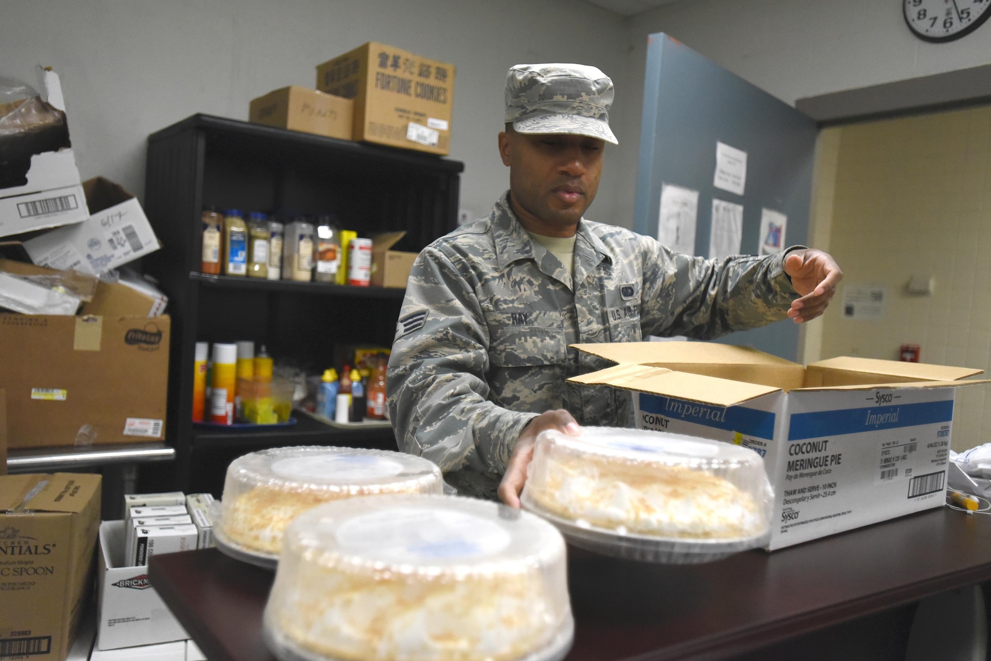 Senior Airman Raymond Ray, a cook for the Kentucky Air National Guard’s 123rd Services Flight in Louisville, Kentucky, sets pies out to thaw in the base dining facility June 6, 2017. Airmen from the unit serve desserts that are both pre-made and made on site. The unit recently was recognized as the best food service organization in the Air National Guard. (U.S. Air National Guard photo by Tech. Sgt. Vicky Spesard)