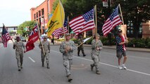 At center, retiring Master Sgt. Gerald Sonnenberg, the outgoing historian of the 932nd Airlift Wing, leads his fellow wing Airmen as they get into position before the start of the VP parade in July, 2017.  Volunteers of the 932nd Airlift Wing in Illinois gave of their time to think of the history of America's Independence Day, and consider other military veterans who went before them, those who sometimes gave the ultimate sacrifice of their lives. Sonnenberg, who retires on July 9 at 2:00 p.m., came up with the various flags and 932nd AW members along with a few retirees worked together to fold them back into proper position at the end of their parade route. The 932nd Airlift Wing had a great group of enthusiastic volunteers who carried the Air Force Reserve name on their banner and represented the unit in the popular Saint Louis parade which was televised live on local networks. The wing plans to help next in the Veterans Day parade in November also. (U.S. Air Force photo by Lt. Col. Stan Paregien)
