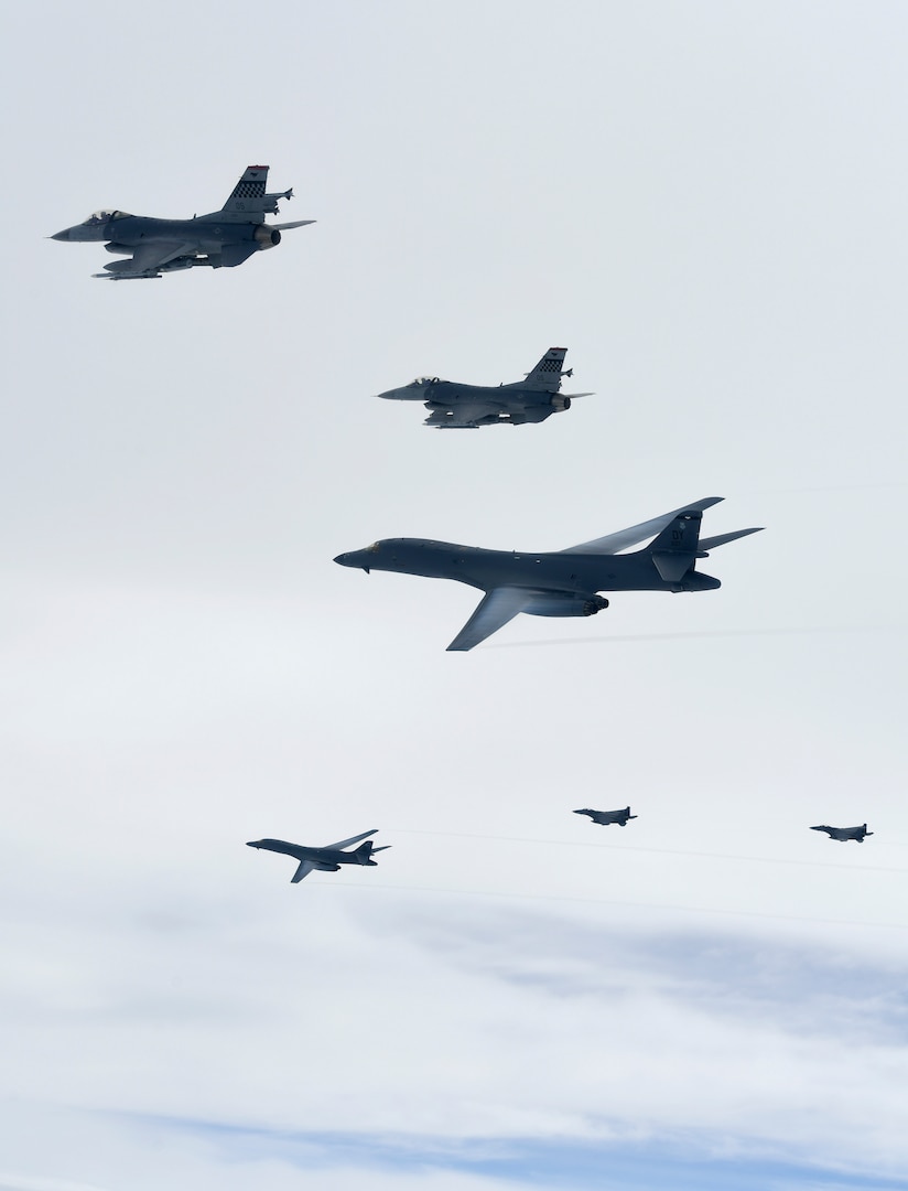 U.S. Air Force B-1B Lancers assigned to the 9th Expeditionary Bomb Squadron, deployed from Dyess Air Force Base, Texas, fly with South Korean F-15 and U.S. Air Force F-16 fighter jets over the Korean Peninsula, July 7. The Lancers departed Andersen Air Force Base, Guam to conduct sequenced bilateral missions with South Korean F-15s and Koku Jieitai (Japan Air Self-Defense Force) F-2 fighter jets. The mission is in response to a series of increasingly escalatory action by North Korea, including a launch of an intercontinental ballistic missile (ICBM) on July 3.(photo courtesy of Republic of Korea air force)