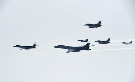 U.S. Air Force B-1B Lancers assigned to the 9th Expeditionary Bomb Squadron, deployed from Dyess Air Force Base, Texas, fly with South Korean F-15 and U.S. Air Force F-16 fighter jets over the Korean Peninsula, July 7. The Lancers departed Andersen Air Force Base, Guam to conduct a sequenced bilateral mission with South Korean F-15s and Koku Jieitai (Japan Air Self-Defense Force) F-2 fighter jets. The air forces successfully integrated and flew with one another despite inclement weather, demonstrating their ability to adapt to and overcome the elements. The mission is in response to a series of increasingly escalatory action by North Korea, including a launch of an intercontinental ballistic missile (ICBM) on July 3. (photo courtesy of Republic of Korea air force)
