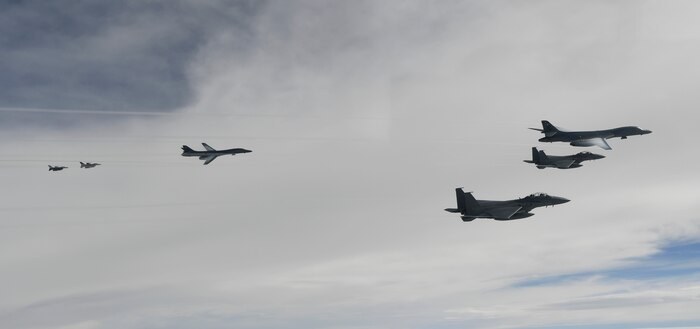 U.S. Air Force B-1B Lancers assigned to the 9th Expeditionary Bomb Squadron, deployed from Dyess Air Force Base, Texas, fly with South Korean F-15 and U.S. Air Force F-16 fighter jets over the Korean Peninsula, July 7. The Lancers departed Andersen Air Force Base, Guam to conduct sequenced bilateral missions with South Korean F-15s and Koku Jieitai (Japan Air Self-Defense Force) F-2 fighter jets. The mission is in response to a series of increasingly escalatory action by North Korea, including a launch of an intercontinental ballistic missile (ICBM) on July 3. (photo courtesy of Republic of Korea air force)