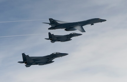 U.S. Air Force B-1B Lancers assigned to the 9th Expeditionary Bomb Squadron, deployed from Dyess Air Force Base, Texas, fly with South Korean F-15 fighter jets over the Korean Peninsula, July 7. The Lancers departed Andersen Air Force Base, Guam to conduct a sequenced bilateral mission with South Korean F-15s and Koku Jieitai (Japan Air Self-Defense Force) F-2 fighter jets. The mission is in response to a series of increasingly escalatory action by North Korea, including a launch of an intercontinental ballistic missile (ICBM) on July 3. (photo courtesy of Republic of Korea air force)