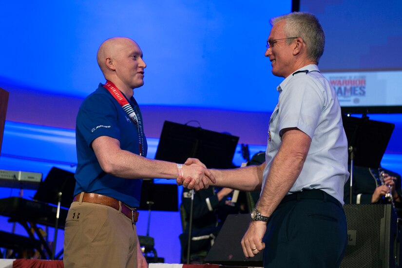 Air Force Gen. Paul J. Selva, vice chairman of the Join Chiefs of Staff, congratulates Air Force Capt. Austin Williamson for winning an Ultimate Champion Medal in the 2017 Department of Defense Warrior Games in Chicago, July 8, 2017. DoD photo by EJ Hersom