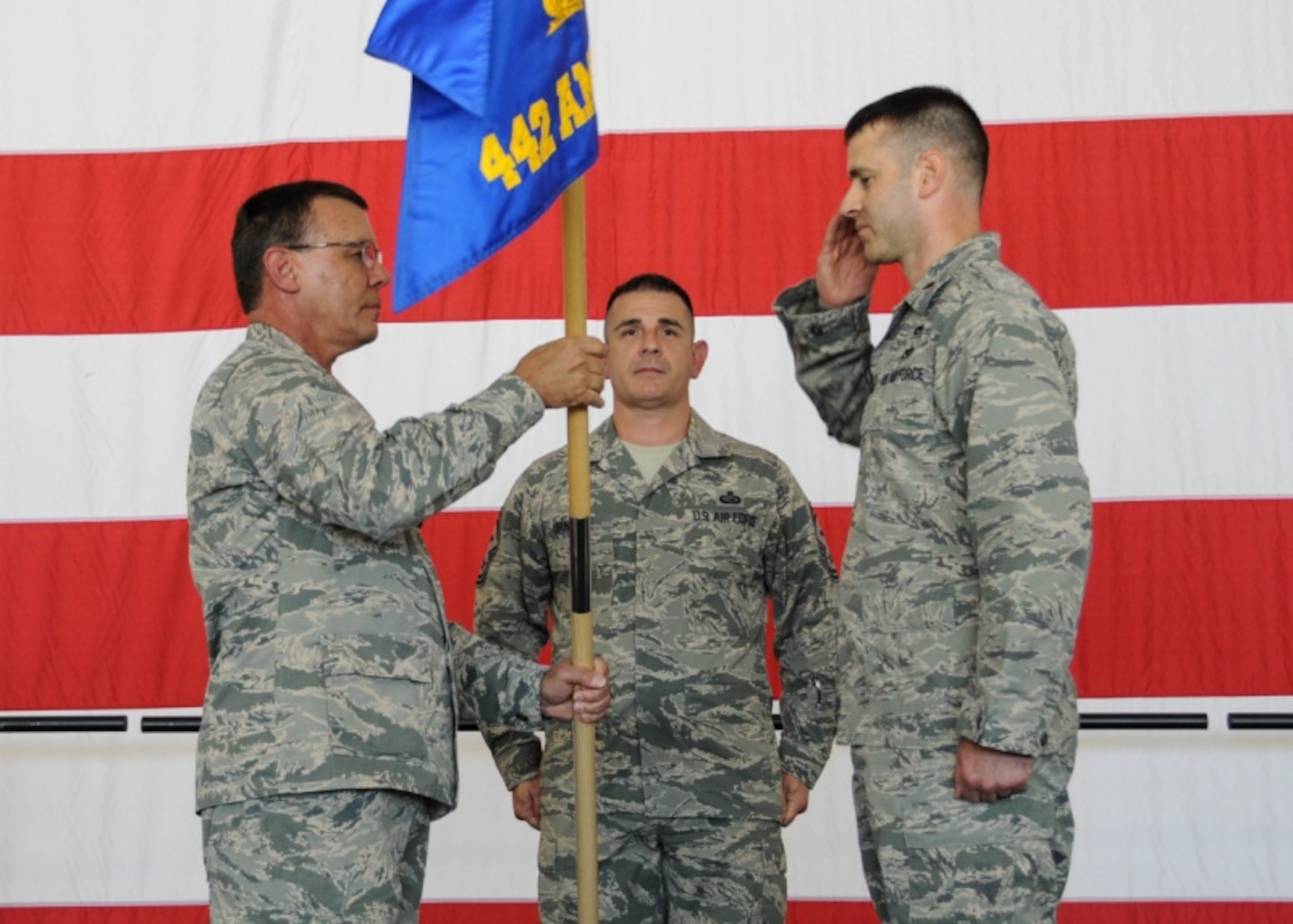 Col. James Brock, 442d Fighter Wing Maintenance Group commander, passes the guidon to Maj. James Chevalier, incoming 442d Aircraft Maintenance Squadron commander, during an assumption of command ceremony at Whiteman Air Force Base, Mo., July 8, 2017. Chevalier's previous assignment was the Implementation Branch Chief, Repair Network Integration Division, Headquarters Air Force Material Command, Wright-Patterson AFB, Oh. (U.S. Air Force photo by Senior Airman Missy Sterling)