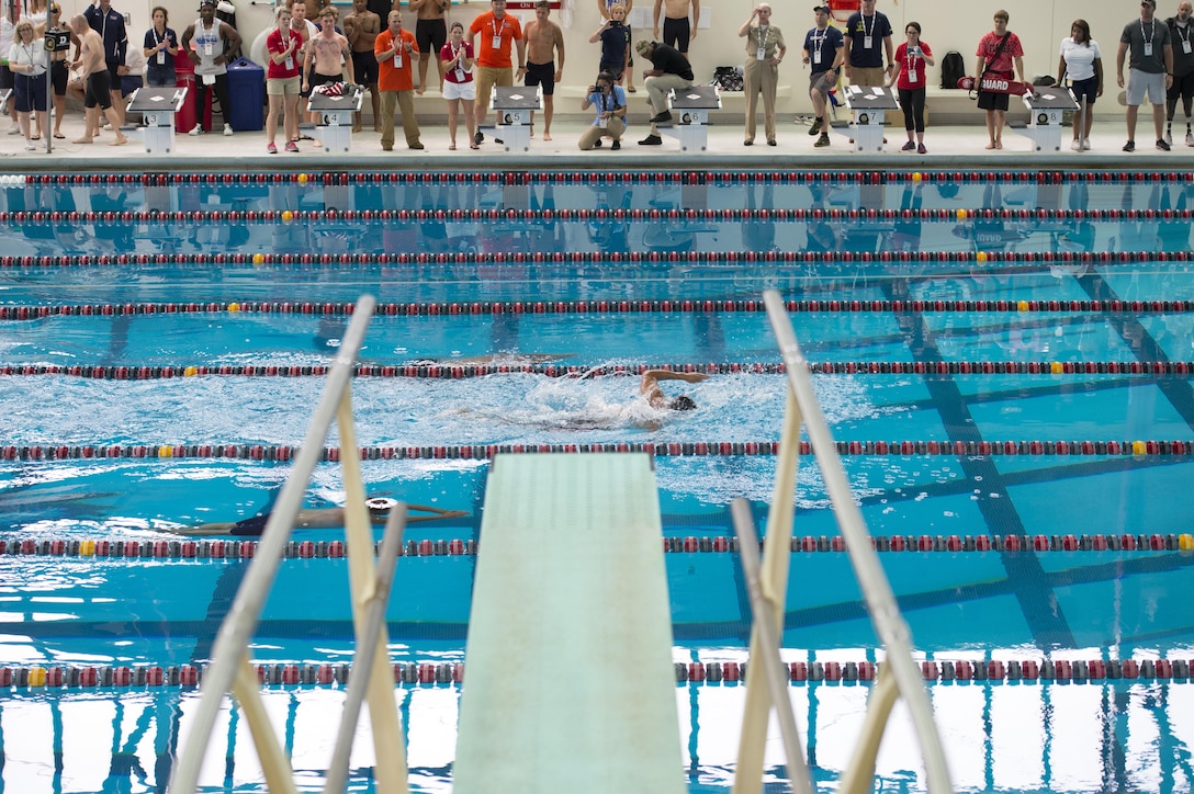 Swimmers race in the University Illinois in Chicago natatorium during the 2017 Department of Defense Warrior Games event in Chicago, July 8, 2017. DoD photo by EJ Hersom