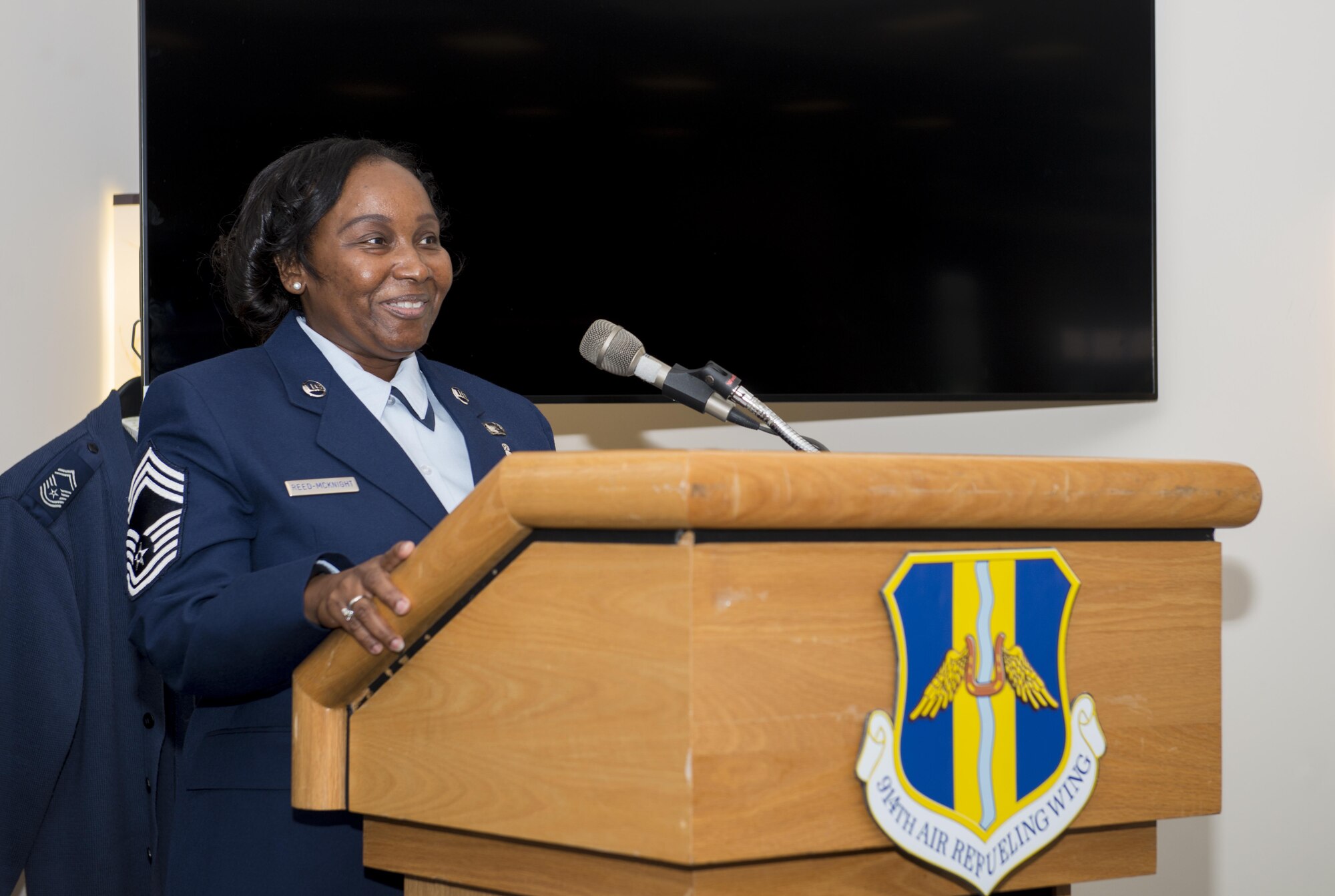 Chief Master Sgt. Francenia Reed-McKnight addresses the room during her promotion ceremony, July 8, 2017, Niagara Falls Air Reserve Station, N.Y. Reed-McKnight is the first member of the Force Support Squadron to be promoted from within the squadron to the rank of Chief since its inception. (U.S. Air Force photo by Tech. Sgt. Stephanie Sawyer)