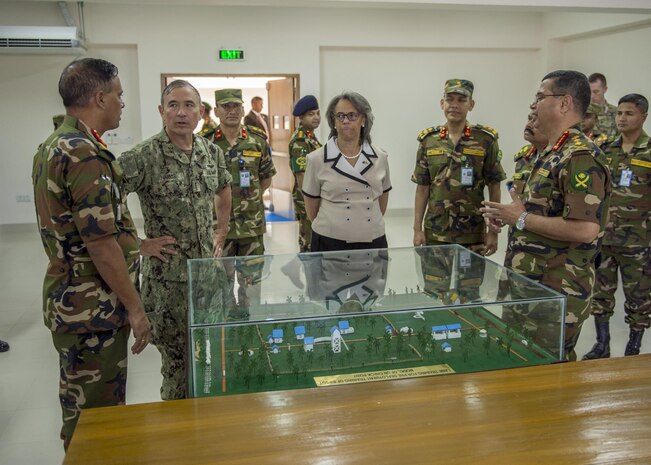 170708-N-WY954-433GAZIPUR, BANGLADESH (July 8, 2017) – Adm. Harry Harris, Commander U.S. Pacific Command (PACOM), center-left, and U.S. Ambassador to Bangladesh Marcia Bernicat, center-right, are given a tour of the Wargame Room at the $3.6 million new multipurpose training facility at the Bangladesh Institute of Peace Support Operations Training (BIPSOT) by BIPSOT Commandant of the, Maj. Gen. Enayet Ullah, right, and Bangladesh Chief of Army Staff Gen. Belal, left. This is Harris’ first visit to Bangladesh as PACOM commander. During the visit he met with counterparts and government officials for discussions on military cooperation and regional security initiatives in the Indo-Asia Pacific. (U.S. Navy photo by Mass Communications Specialist 2nd Class Robin W. Peak/ Released)