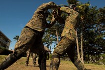 NOUMEA, NEW CALEDONIA— Sgt. Aaron Medlin, left, and Lance Cpl. Ryan Murray spar while participating in the French Nautical Commando Course during exercise Koa Moana, July 3, 2017, in Noumea, New Caledonia. Koa Moana 17 is designed to improve theater security, and conduct law enforcement and infantry training in the Pacific region in order to enhance interoperability with partner nations. Medlin is a rifleman with 3rd Battalion, 4th Marine Regiment, currently deployed to Koa Moana 17, and a Monroe, North Carolina, native. Murray is a rifleman with 3rd Battalion, 4th Marine Regiment, and a Sevierville, Tennessee, native. (U.S. Marine Corps Photo by Sgt. Douglas D. Simons)