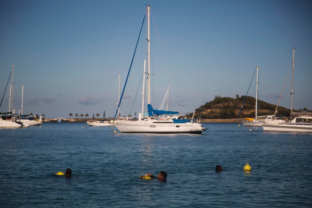 NOUMEA, NEW CALEDONIA— Marines with 3rd Battalion, 4th Marine Regiment, currently deployed to Koa Moana 17, scrub buoys after participating in the French Nautical Commando Course during exercise Koa Moana 17, July 3, 2017, in Noumea, New Caledonia. Koa Moana 17 is designed to improve theater security, and conduct law enforcement and infantry training in the Pacific region in order to enhance interoperability with partner nations. (U.S. Marine Corps Photo by Sgt. Douglas D. Simons)