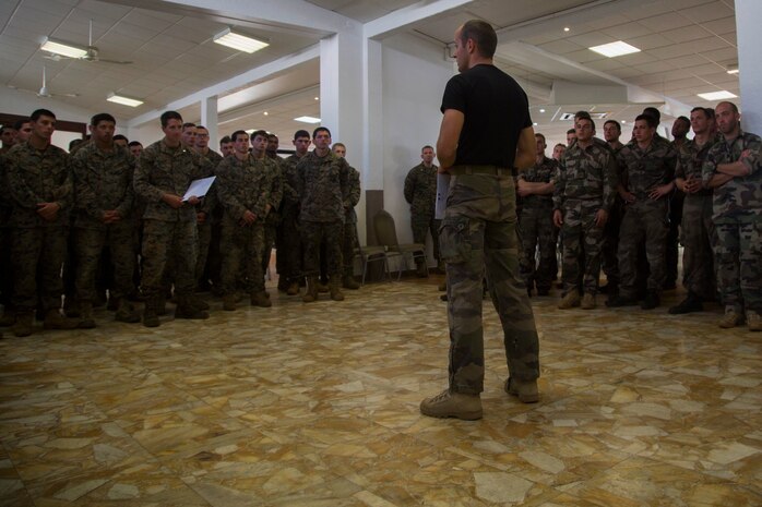 Capt. Roch Sardin, commanding officer of the Centre D’instruction Nautique, front, gives closing remarks after Marines and Sailors with 3rd Battalion, 4th Marine Regiment, participated in the French Nautical Commando Course during exercise Koa Moana 17, July 3, 2017, in Noumea, New Caledonia. Koa Moana 17 is designed to improve theater security, and conduct law enforcement and infantry training in the Pacific region in order to enhance interoperability with partner nations. (U.S. Marine Corps Photo by Sgt. Douglas D. Simons)