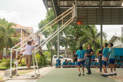 170530-N-PD309-047 PATTAYA, Thailand (May 30, 2017) Sailors assigned to littoral combat ship USS Coronado (LCS 4) play basketball with children at Ban Bang Lamung School as part of a community relations event during Cooperation Afloat Readiness and Training (CARAT) Thailand. CARAT is a series of Pacific Command-sponsored, U.S Pacific Fleet-led bilateral exercises held annually in South and Southeast Asia to strengthen relationships and enhance force readiness. CARAT exercise events cover a broad range of naval skill areas and disciplines including surface, undersea, air, and amphibious warfare; maritime security operations; riverine, jungle, and explosive ordnance disposal operations; combat construction; diving and salvage; search and rescue; maritime patrol and reconnaissance aviation; maritime domain awareness; military law, public affairs and military medicine; and humanitarian assistance and disaster response. (U.S. Navy photo by Mass Communication Specialist 3rd Class Deven Leigh Ellis/Released)