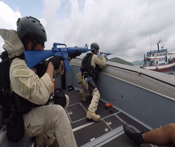 170531-M-YO248-002 SATTAHIP NAVAL BASE, Thailand (May 31, 2017) USS Coronado (LCS) Visit Board Search and Seizure team members take control of a fishing vessel as part of a training simulation during Cooperation Afloat Readiness and Training Thailand 2017 May 31.  Cooperation Afloat Readiness and Training (CARAT) is a series of PACOM sponsored, U.S. Pacific Fleet led bilateral exercises held annually in South and Southeast Asia to strengthen relationships and enhance force readiness. CARAT exercise events cover a broad range of naval skill areas and disciplines including surface, undersea, air and amphibious warfare; maritime security operations; riverine, jungle and explosive ordnance disposal operations; combat construction; diving and salvage; search and rescue; maritime patrol and reconnaissance aviation; maritime domain awareness; military law, public affairs and military medicine; and humanitarian assistance, disaster response. (U.S. Navy photo by Lance Corporal Jacob Colvin/RELEASED)